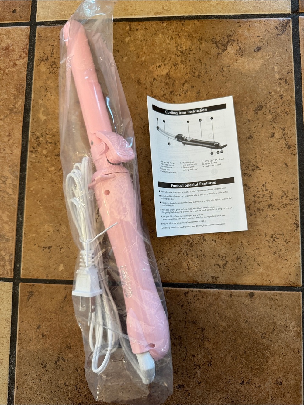 NEW pink rotating curling iron